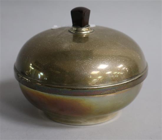 A George V silver and celluloid lidded circular powder box, 11.5cm.